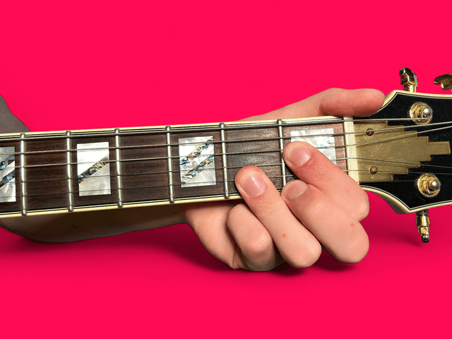 Ab7sus4 guitar chord with finger positions