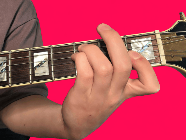 F minor over C guitar chord with finger positions